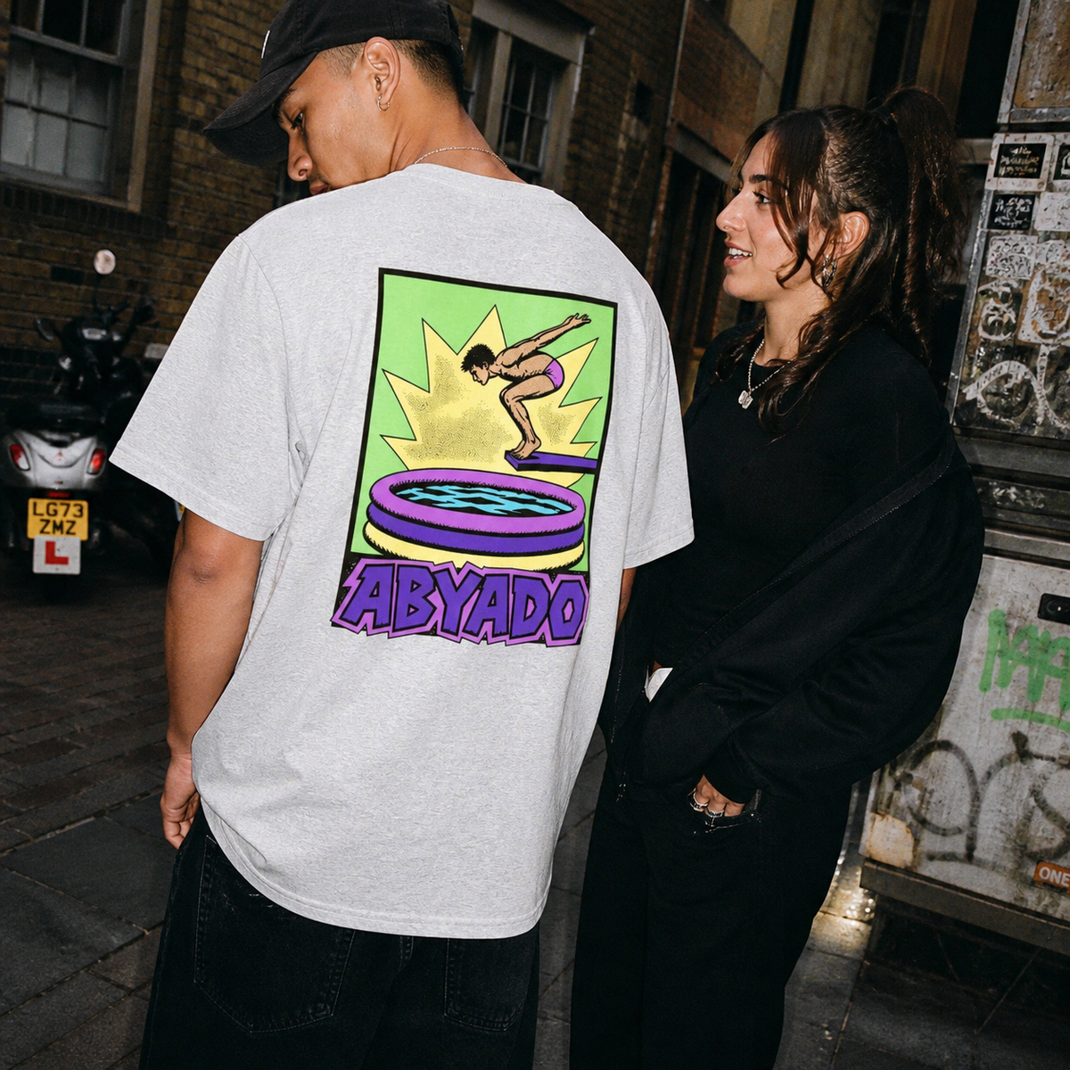 Inflatable Tee lifestyle — Ash back graphic — two models 1:1