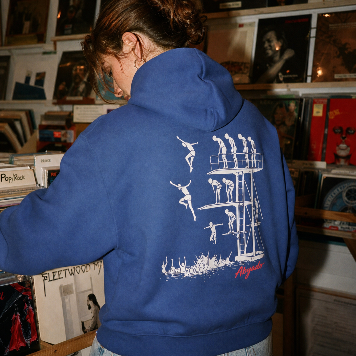 Manhood Hoodie lifestyle — Cobalt back graphic — record shop 1:1