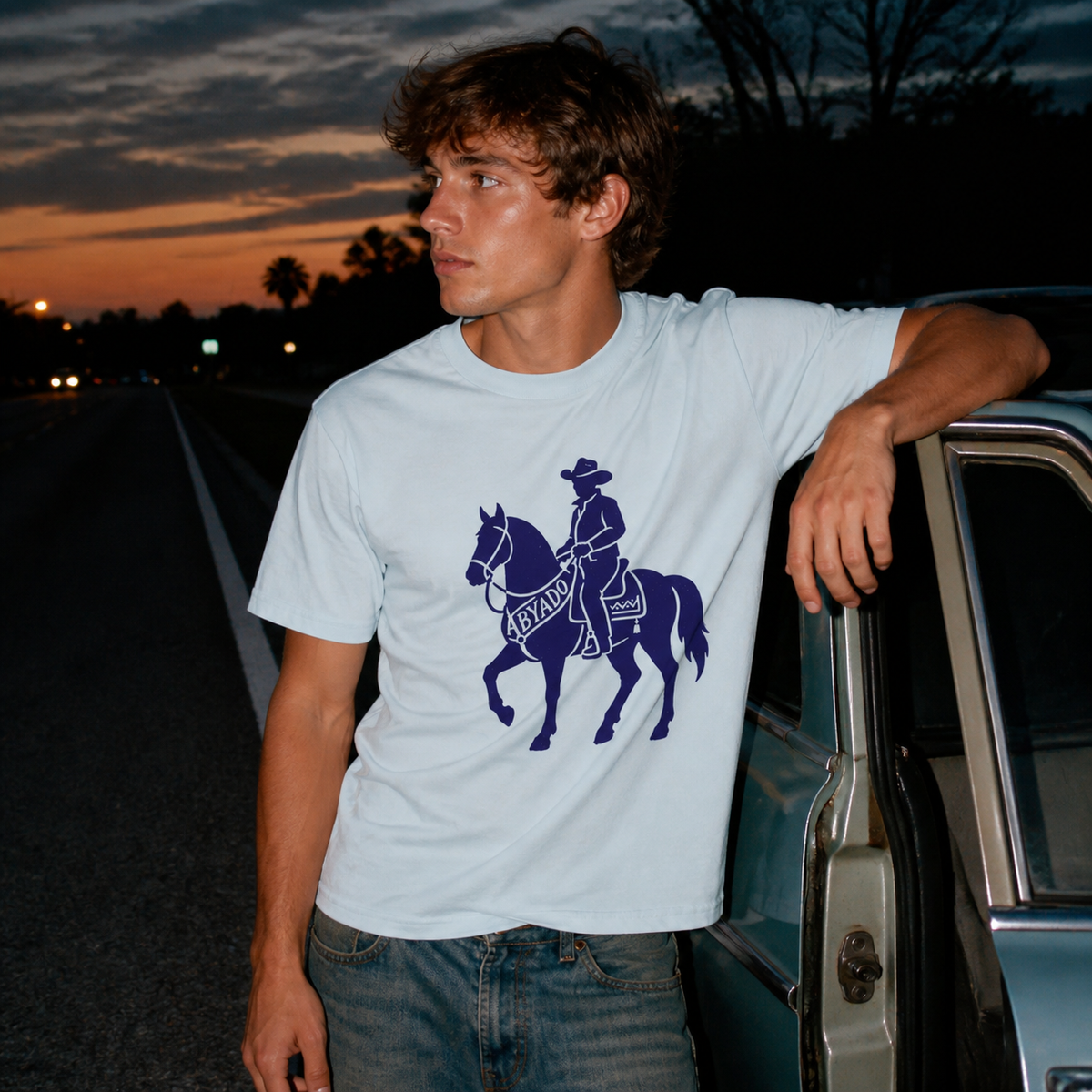Marston Tee lifestyle — Light Blue front graphic — roadside 1:1