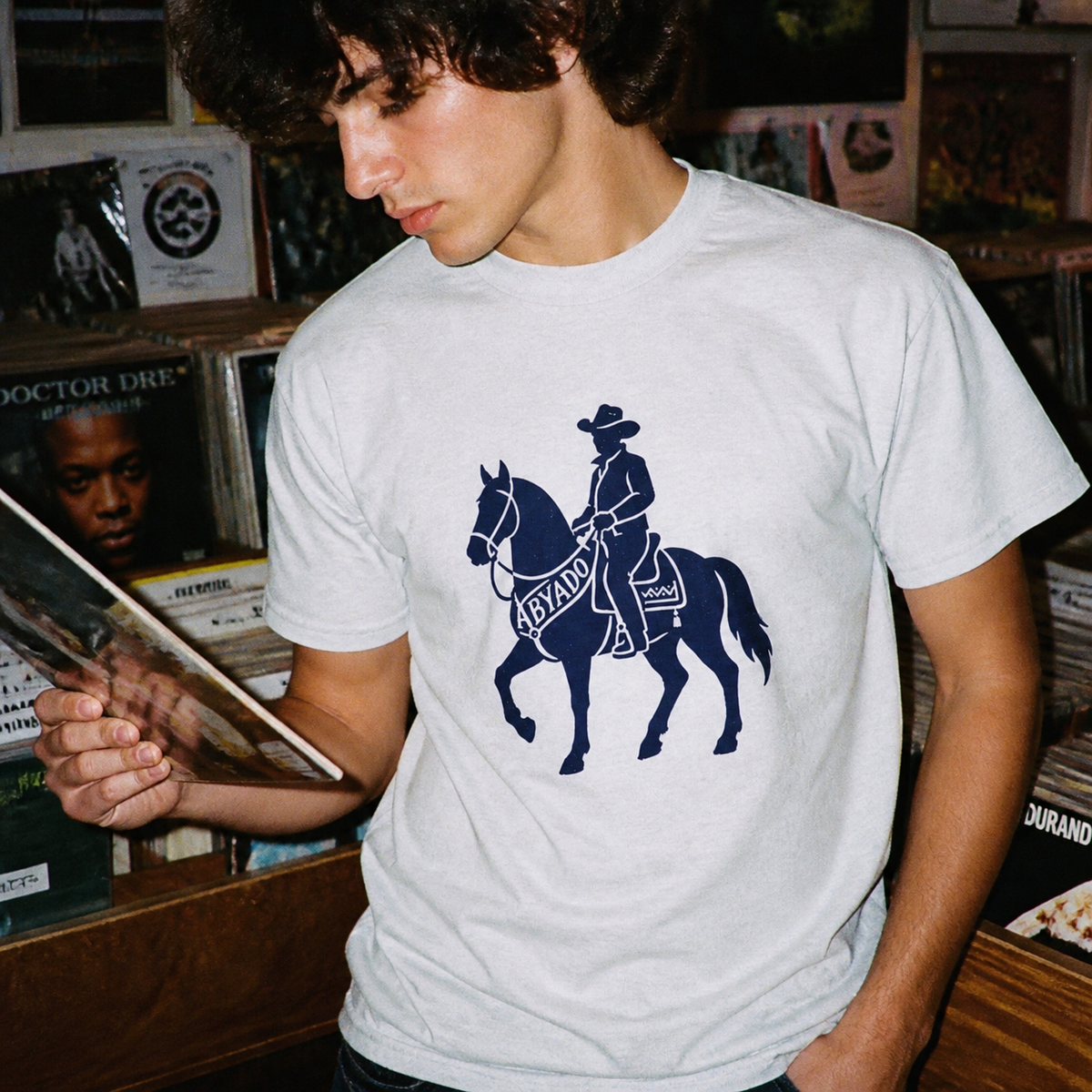 Marston Tee lifestyle — Ash front graphic — record shop detail 1:1