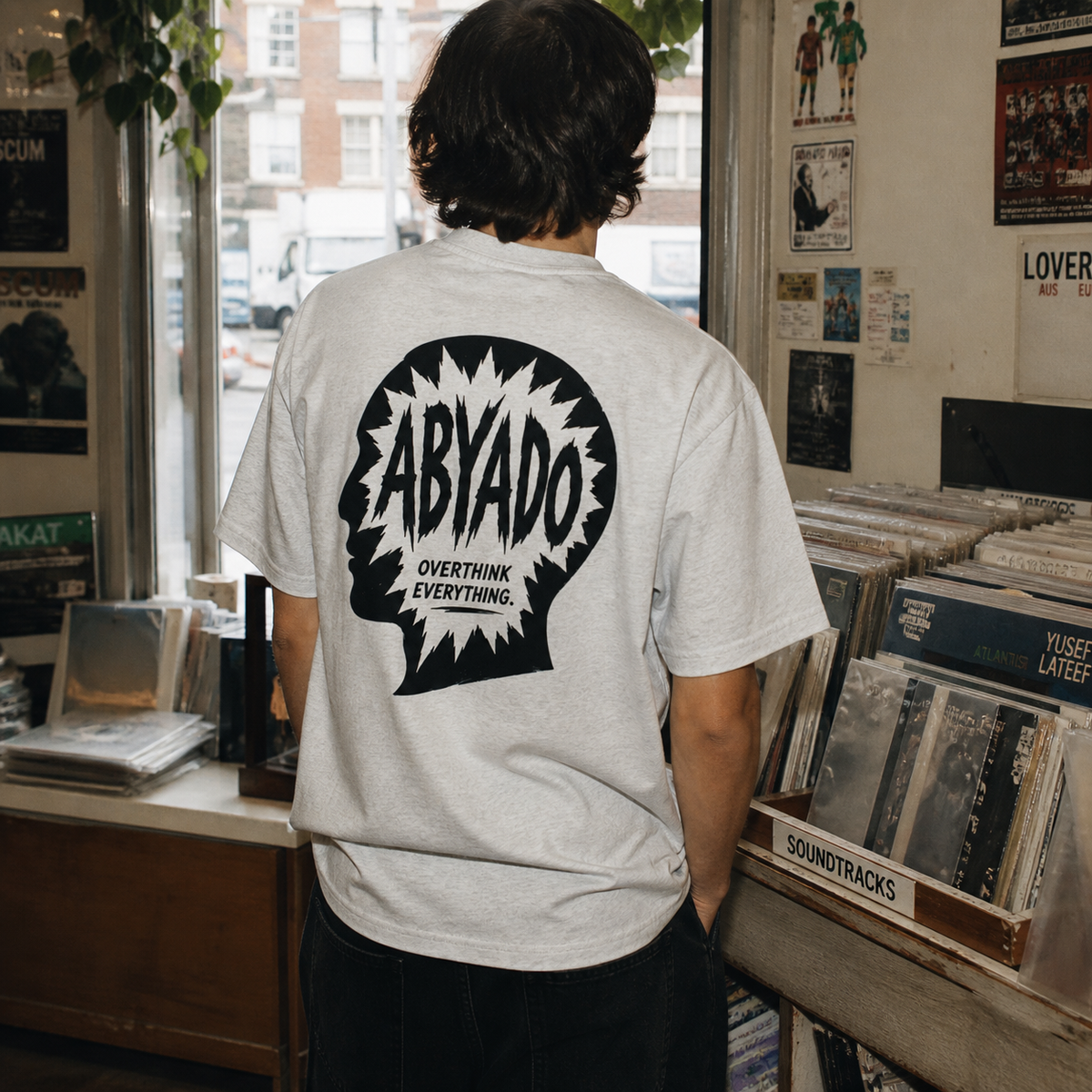 Overthink Tee lifestyle photograph showing the back graphic