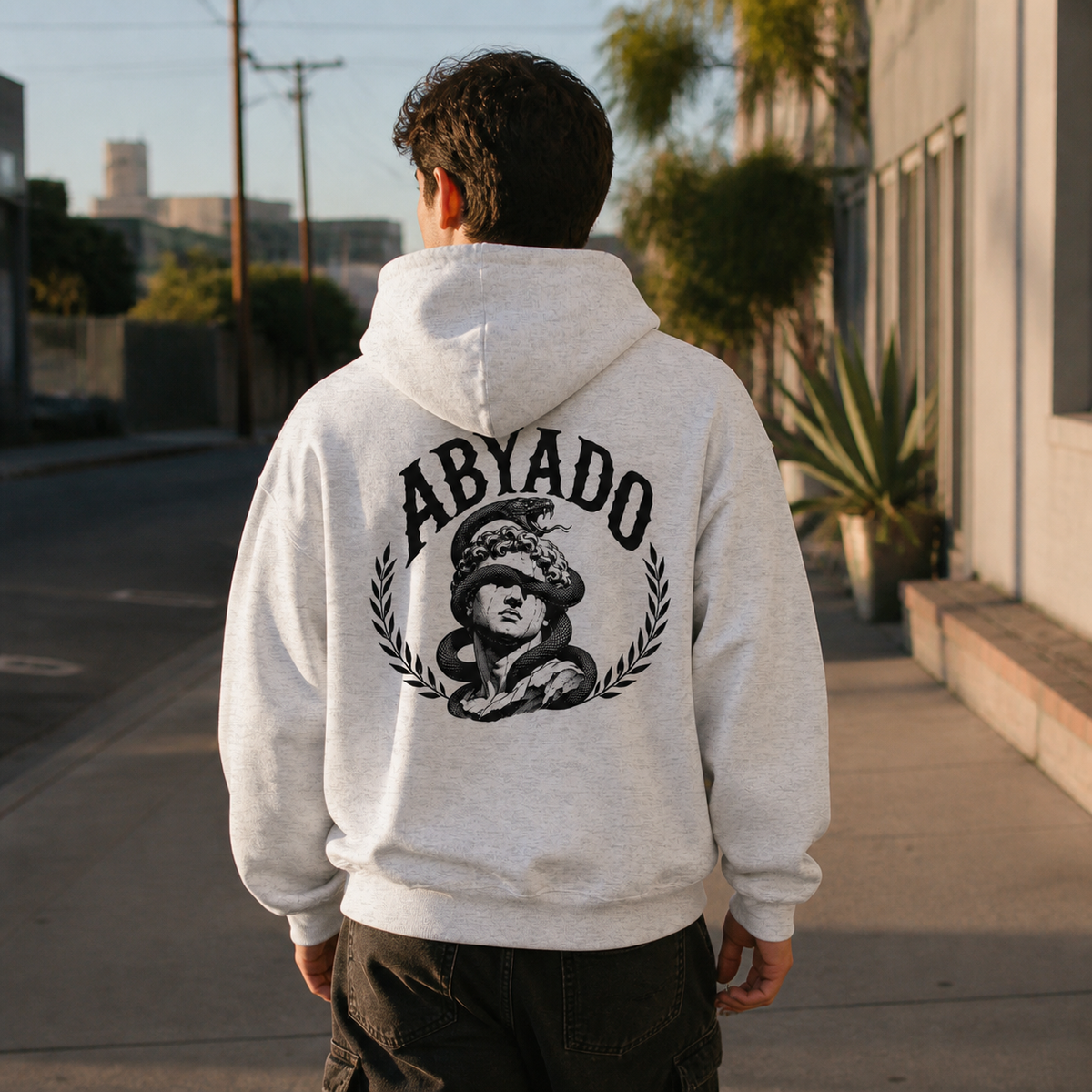Relics Hoodie in White Heather, back view, film streetwear lifestyle photograph