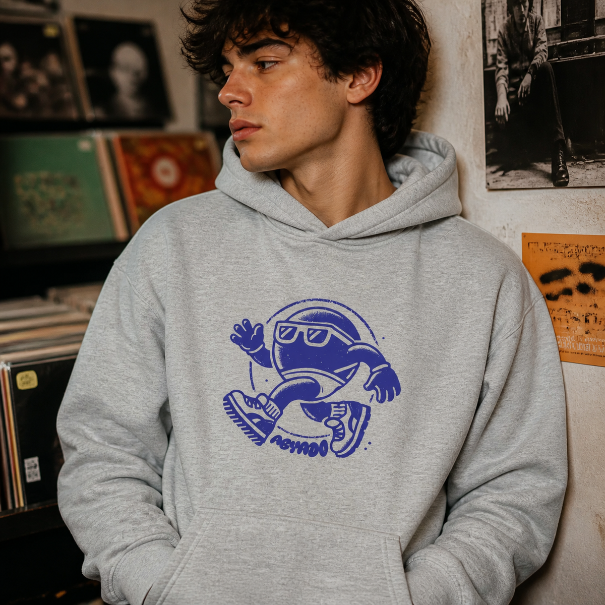 'Walking Spot' Hoodie lifestyle — athletic heather in record shop